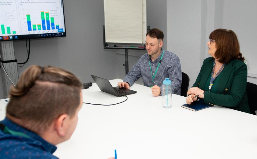 Three people in a meeting